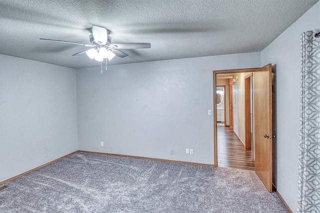 1439 Greenbriar Dr, Norman, OK 73072 - carpeted spare room featuring a ceiling fan, a textured ceiling, and baseboards