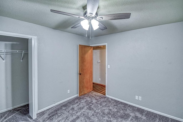1439 Greenbriar Dr, Norman, OK 73072 - unfurnished bedroom with carpet, a closet, a textured ceiling, a ceiling fan, and baseboards