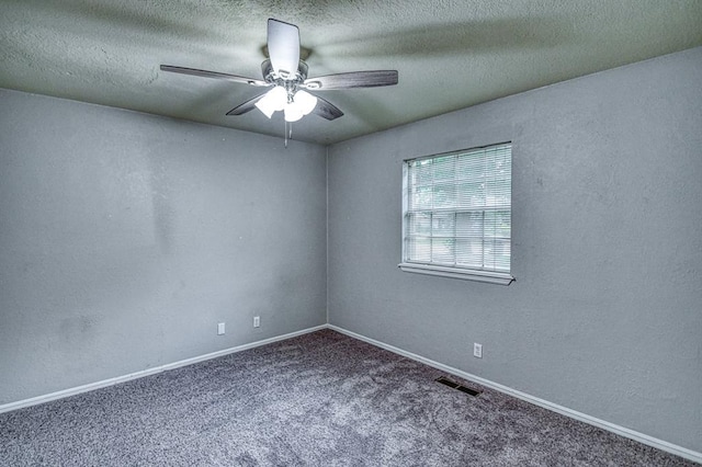 1439 Greenbriar Dr, Norman, OK 73072 - carpeted spare room with ceiling fan, a textured ceiling, baseboards, and a textured wall