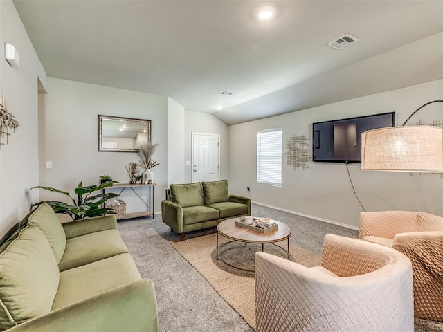 1316 Chuck Wagon Dr, El Reno, OK 73036 - carpeted living room featuring lofted ceiling and baseboards
