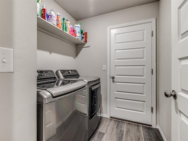 1316 Chuck Wagon Dr, El Reno, OK 73036 - laundry area with washer and clothes dryer, light wood finished floors, and baseboards