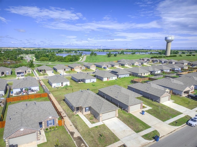1316 Chuck Wagon Dr, El Reno, OK 73036 - aerial perspective of suburban area featuring a large body of water