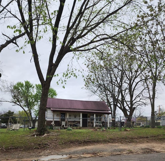310 Mcgee St, Eufaula, OK 74432 - view of front of property with a metal roof