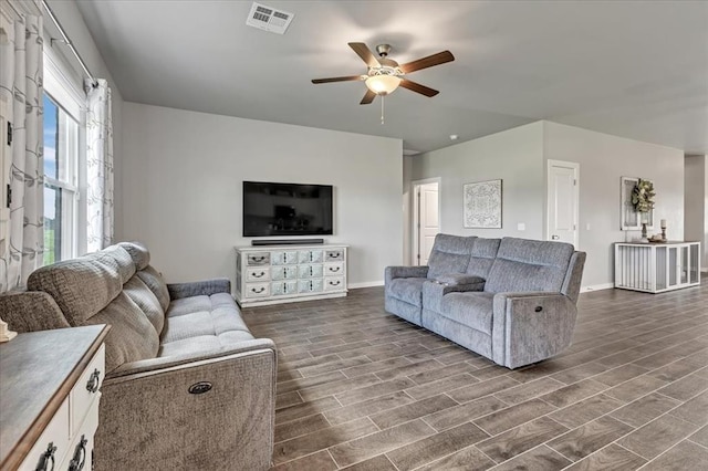 13091 Mannington Rd, Edmond, OK 73025 - living area featuring ceiling fan, baseboards, and dark wood-style flooring