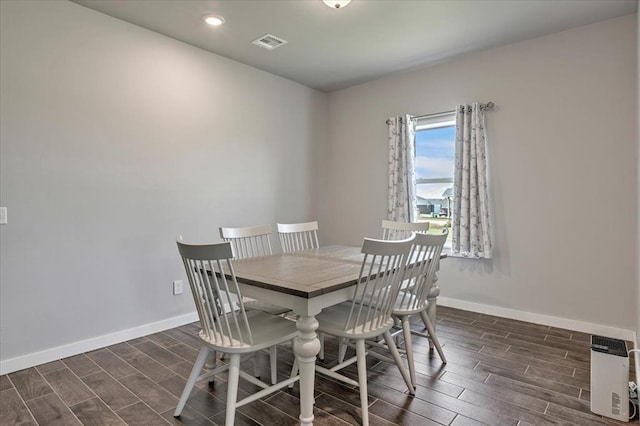 13091 Mannington Rd, Edmond, OK 73025 - dining area featuring wood tiled floors, baseboards, and recessed lighting