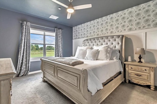 13091 Mannington Rd, Edmond, OK 73025 - bedroom featuring dark carpet, baseboards, and a ceiling fan