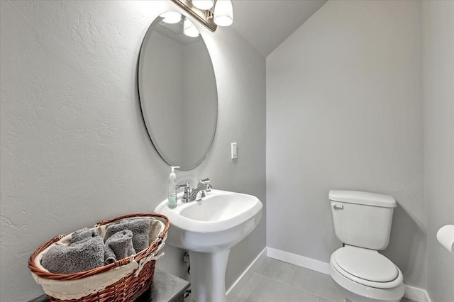 13091 Mannington Rd, Edmond, OK 73025 - half bath with toilet, tile patterned flooring, and lofted ceiling