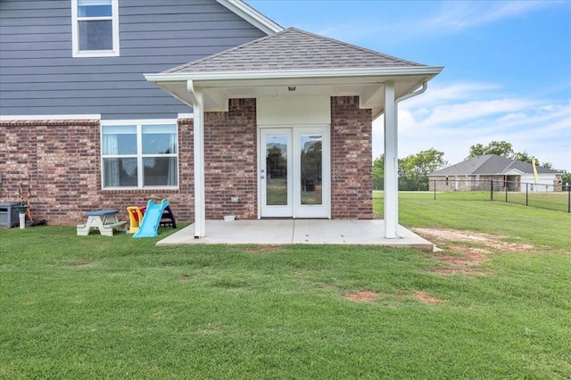 13091 Mannington Rd, Edmond, OK 73025 - rear view of house featuring brick siding, a patio, and a shingled roof