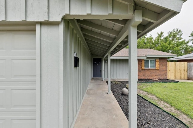 2617 SW 69th St, Oklahoma City, OK 73159 - entrance to property with board and batten siding, brick siding, and roof with shingles