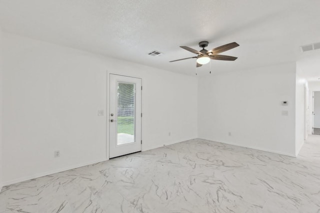 2617 SW 69th St, Oklahoma City, OK 73159 - unfurnished room featuring a ceiling fan and light marble finish flooring