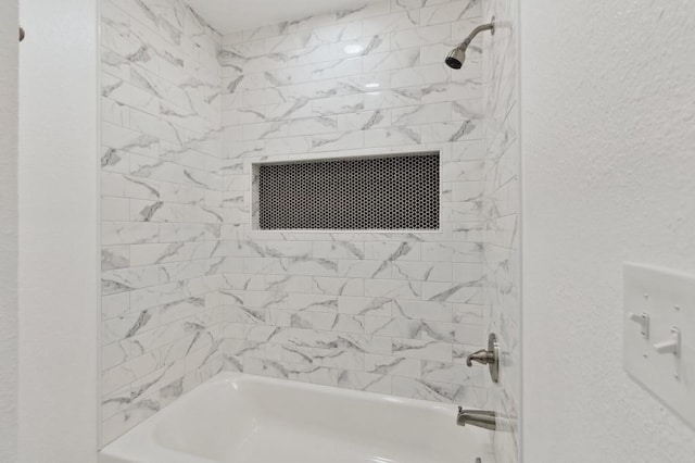 2617 SW 69th St, Oklahoma City, OK 73159 - bathroom with tub / shower combination and a textured wall