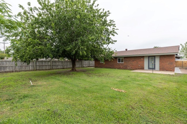 2617 SW 69th St, Oklahoma City, OK 73159 - fenced backyard featuring a patio