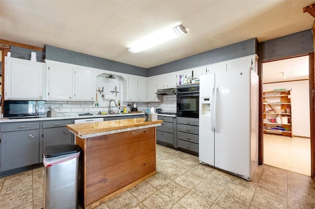 431 Canoe Rd, Broken Bow, OK 74728 - kitchen with black appliances, gray cabinetry, light countertops, a sink, and under cabinet range hood