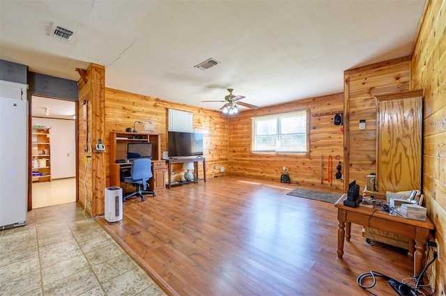 431 Canoe Rd, Broken Bow, OK 74728 - living area featuring a desk, wooden walls, ceiling fan, and wood finished floors