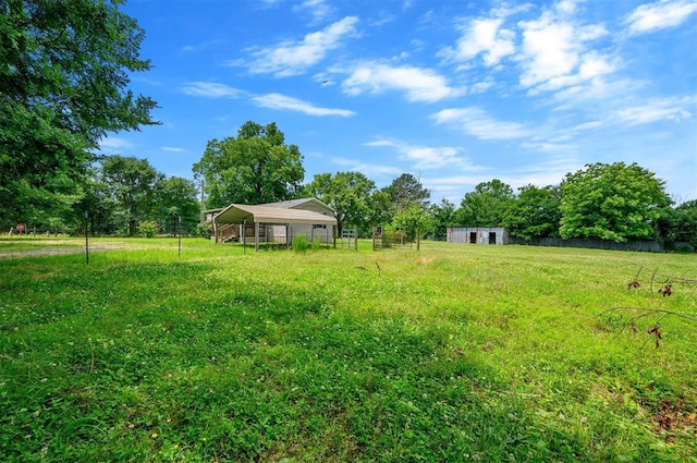 2991 Peavey Xing, Broken Bow, OK 74728 - view of yard featuring a detached carport, an outbuilding, and a pole building