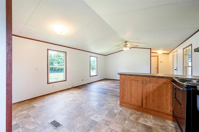 2991 Peavey Xing, Broken Bow, OK 74728 - kitchen featuring black range oven, vaulted ceiling, baseboards, a ceiling fan, and ornamental molding