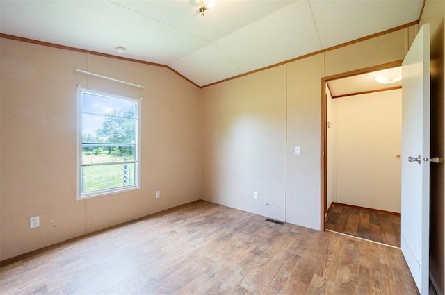 2991 Peavey Xing, Broken Bow, OK 74728 - unfurnished bedroom with lofted ceiling, light wood-style flooring, and ornamental molding