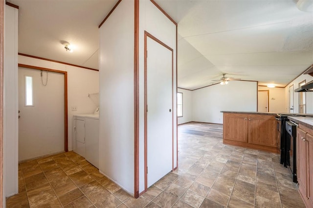 2991 Peavey Xing, Broken Bow, OK 74728 - kitchen featuring separate washer and dryer, stone finish floors, a ceiling fan, brown cabinets, and lofted ceiling