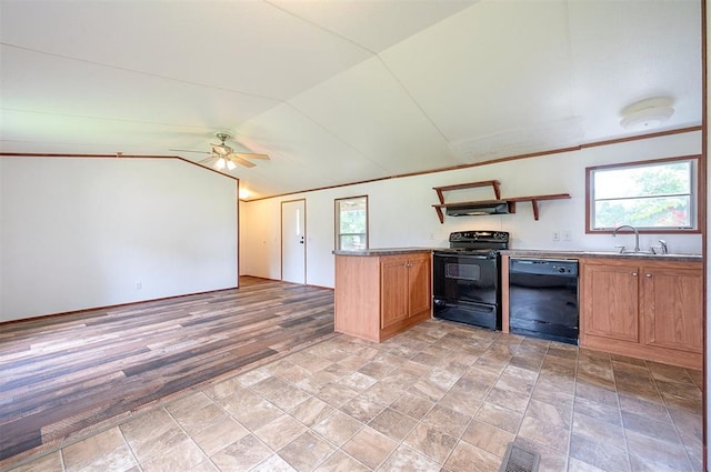 2991 Peavey Xing, Broken Bow, OK 74728 - kitchen with black appliances, ceiling fan, vaulted ceiling, under cabinet range hood, and brown cabinets