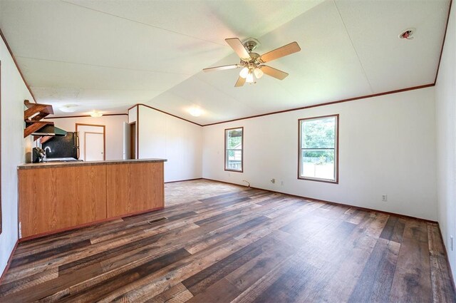 2991 Peavey Xing, Broken Bow, OK 74728 - unfurnished living room with dark wood-style floors, ceiling fan, lofted ceiling, ornamental molding, and baseboards