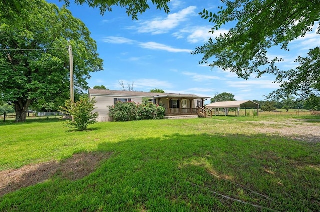 2991 Peavey Xing, Broken Bow, OK 74728 - view of yard featuring a detached carport and covered porch