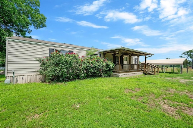 2991 Peavey Xing, Broken Bow, OK 74728 - rear view of property featuring a yard and covered porch