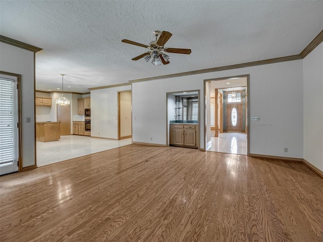 3713 Barwick Ct, Norman, OK 73072 - unfurnished living room with light wood finished floors, crown molding, a ceiling fan, baseboards, and a textured ceiling