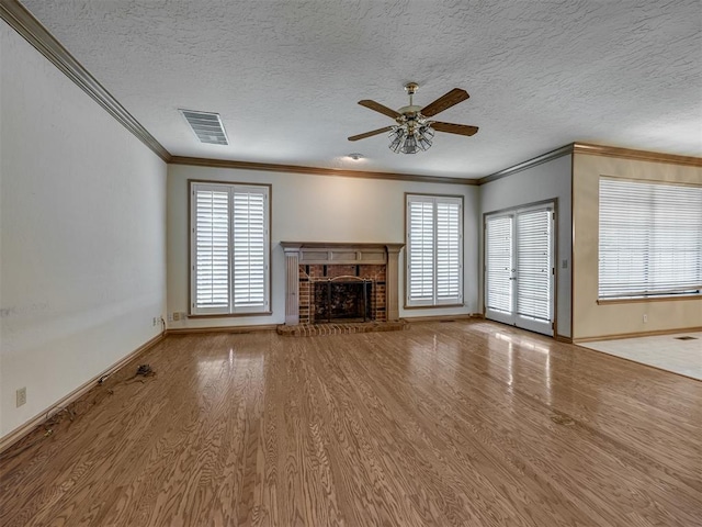 3713 Barwick Ct, Norman, OK 73072 - unfurnished living room with wood finished floors, a ceiling fan, ornamental molding, baseboards, and a fireplace