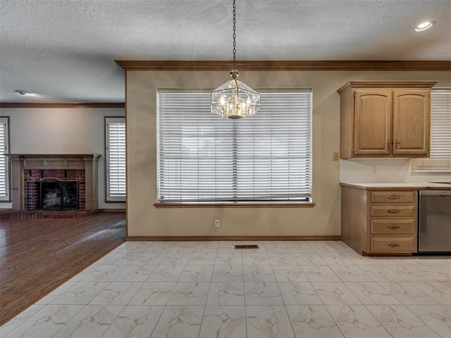 3713 Barwick Ct, Norman, OK 73072 - kitchen featuring dishwasher, light marble finish floors, a textured ceiling, baseboards, and crown molding