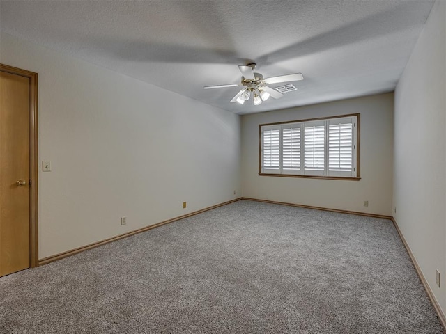 3713 Barwick Ct, Norman, OK 73072 - spare room featuring light carpet, a ceiling fan, baseboards, and a textured ceiling