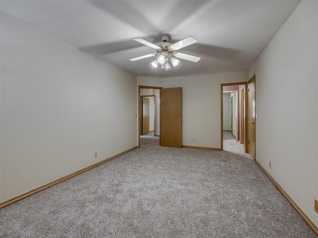 3713 Barwick Ct, Norman, OK 73072 - unfurnished bedroom with light colored carpet, baseboards, and ceiling fan