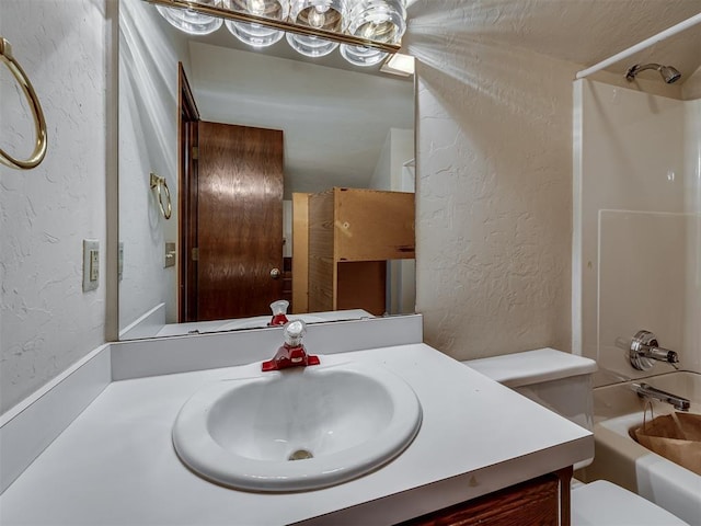 3713 Barwick Ct, Norman, OK 73072 - full bathroom with a textured wall, toilet, bathing tub / shower combination, and vanity