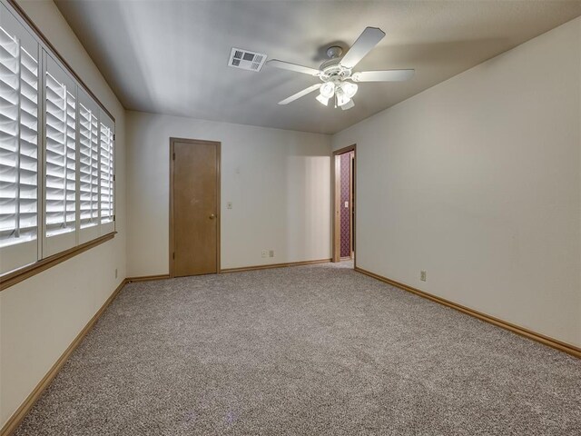 3713 Barwick Ct, Norman, OK 73072 - empty room with light colored carpet, baseboards, and a ceiling fan