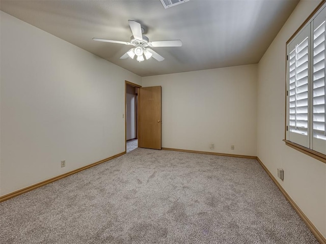 3713 Barwick Ct, Norman, OK 73072 - empty room featuring light carpet, ceiling fan, and baseboards