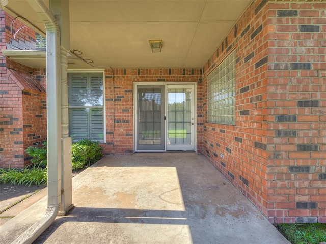 3713 Barwick Ct, Norman, OK 73072 - view of exterior entry featuring brick siding
