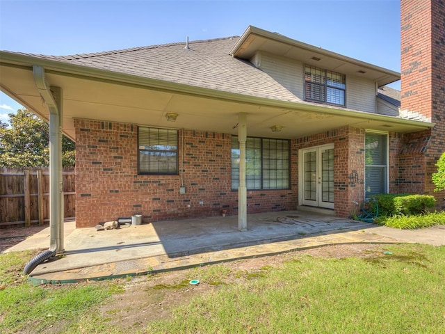 3713 Barwick Ct, Norman, OK 73072 - rear view of property featuring french doors, a patio area, brick siding, and a shingled roof