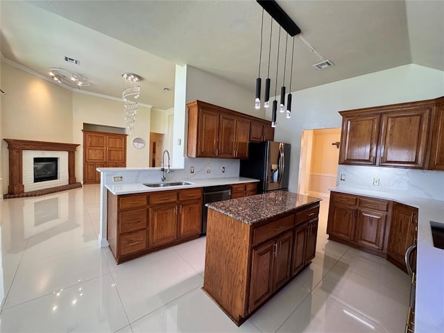 4409 Whitmere Ct, Norman, OK 73072 - kitchen featuring refrigerator with ice dispenser, dishwasher, a kitchen island, pendant lighting, and light tile patterned flooring