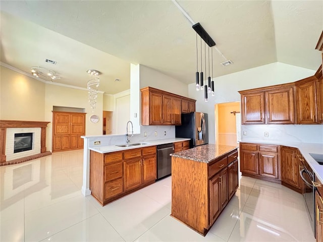 4409 Whitmere Ct, Norman, OK 73072 - kitchen with dishwashing machine, refrigerator with ice dispenser, a center island, a peninsula, and brown cabinetry