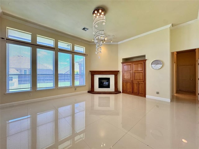 4409 Whitmere Ct, Norman, OK 73072 - unfurnished living room with ornamental molding, a chandelier, light tile patterned floors, plenty of natural light, and a fireplace