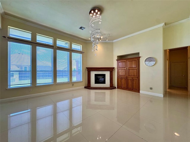 4409 Whitmere Ct, Norman, OK 73072 - unfurnished living room with ornamental molding, a chandelier, light tile patterned floors, healthy amount of natural light, and a brick fireplace