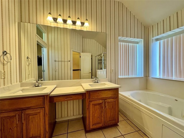 4409 Whitmere Ct, Norman, OK 73072 - bathroom with wallpapered walls, double vanity, a bath, tile patterned floors, and lofted ceiling