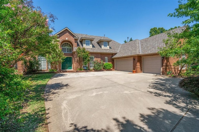 4609 Summerfield Ct, Norman, OK 73072 - traditional home featuring brick siding, a garage, and concrete driveway