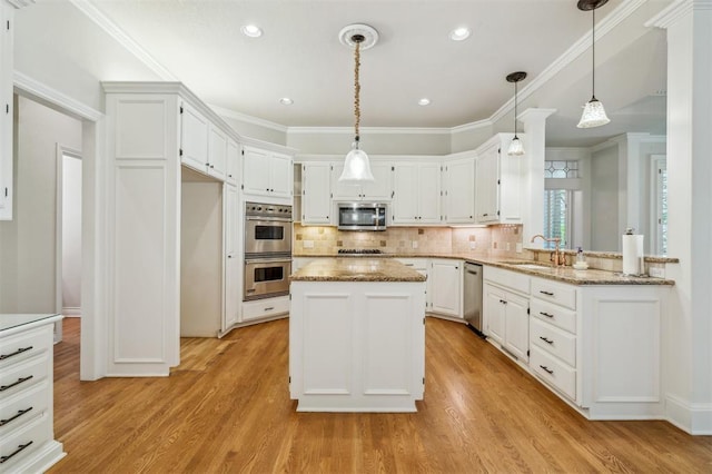 4609 Summerfield Ct, Norman, OK 73072 - kitchen with stainless steel appliances, a sink, white cabinetry, light wood-type flooring, and crown molding