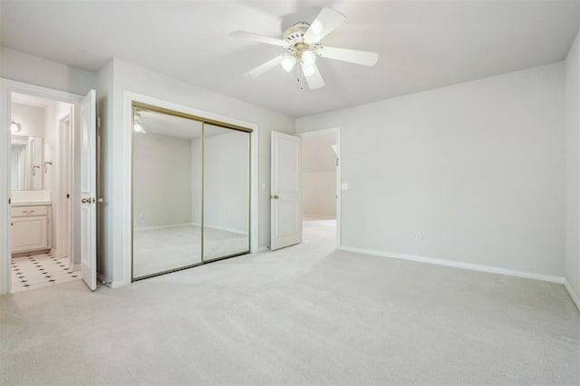 4609 Summerfield Ct, Norman, OK 73072 - unfurnished bedroom with light carpet, a closet, baseboards, ensuite bath, and ceiling fan