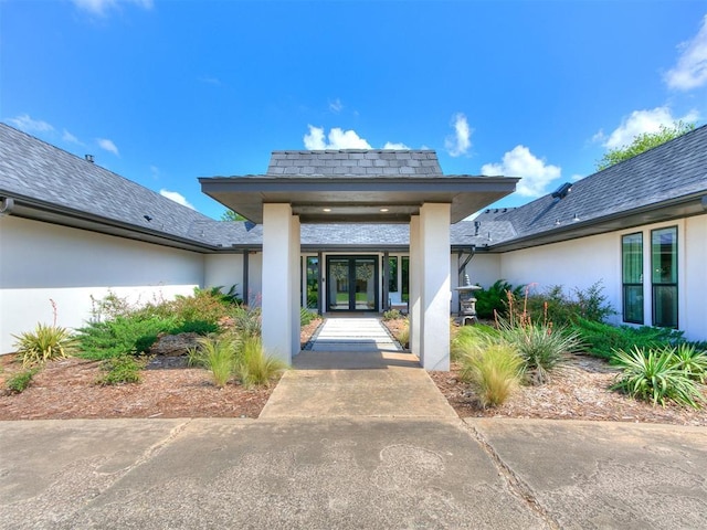 4107 Northhampton Dr, Norman, OK 73072 - view of exterior entry featuring french doors and stucco siding