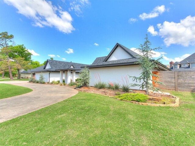 4107 Northhampton Dr, Norman, OK 73072 - view of front of property featuring stucco siding and driveway