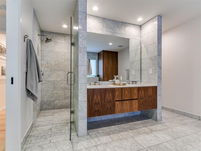 4107 Northhampton Dr, Norman, OK 73072 - bathroom with a shower stall, double vanity, and recessed lighting