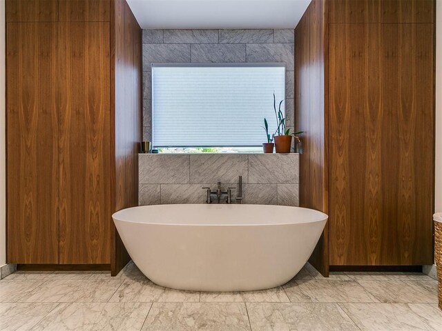 4107 Northhampton Dr, Norman, OK 73072 - bathroom with marble finish floors and a freestanding tub