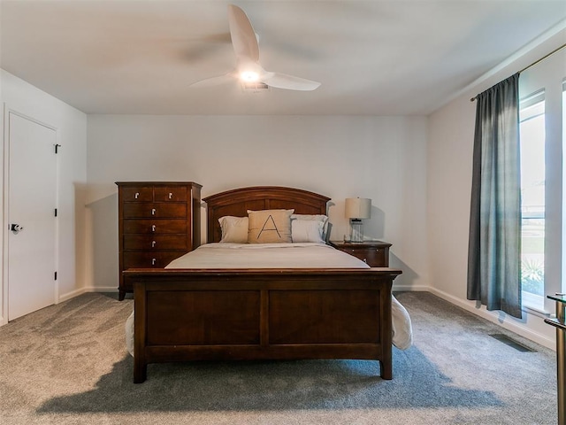 4107 Northhampton Dr, Norman, OK 73072 - carpeted bedroom featuring multiple windows and ceiling fan