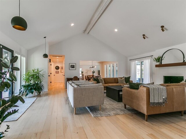 4107 Northhampton Dr, Norman, OK 73072 - living room with beamed ceiling, high vaulted ceiling, and light wood-style floors